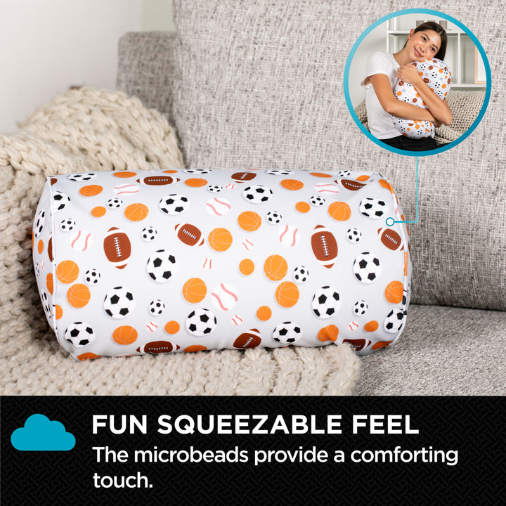 Squeezable pillow with sports pattern on a couch, featuring text about microbeads.