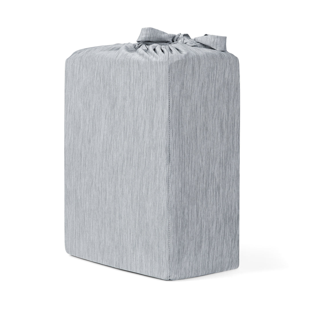 Gray striped ottoman on a white background