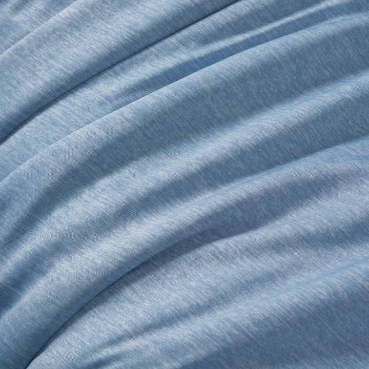 Close-up of blue fabric with folds