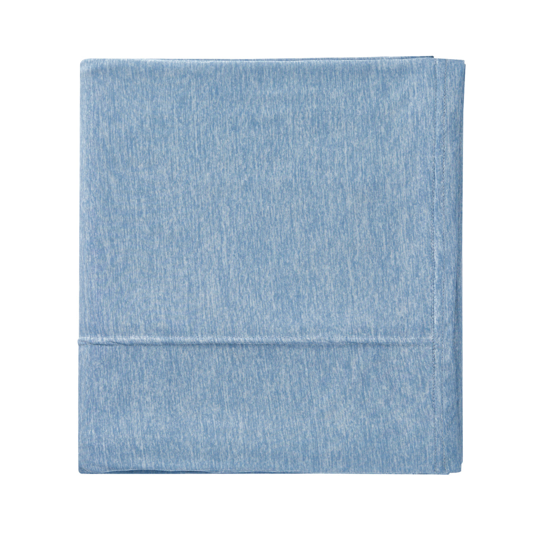 Light blue denim fabric on a white background