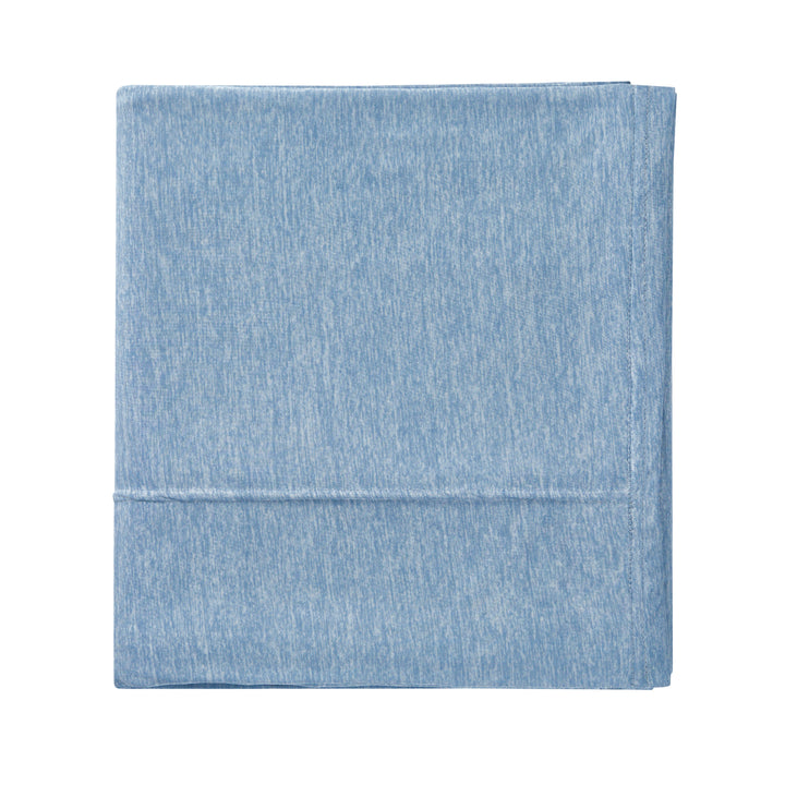 Light blue denim fabric on a white background