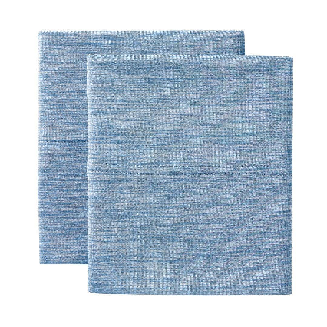 Two blue textured bath mats on a white background
