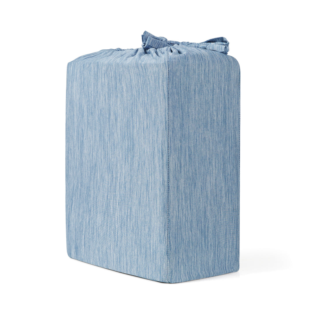 Blue textured cube-shaped ottoman on a white background