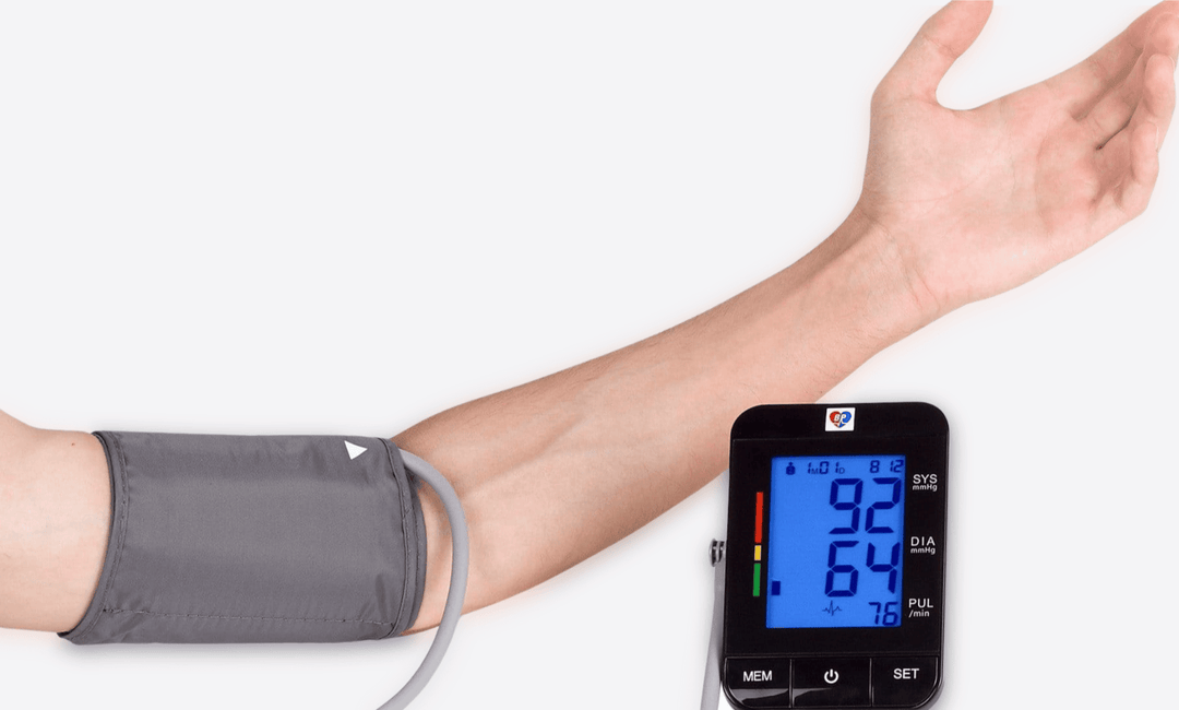 Wizard Research Blood Pressure Monitor in use with cuff on arm showing digital reading
